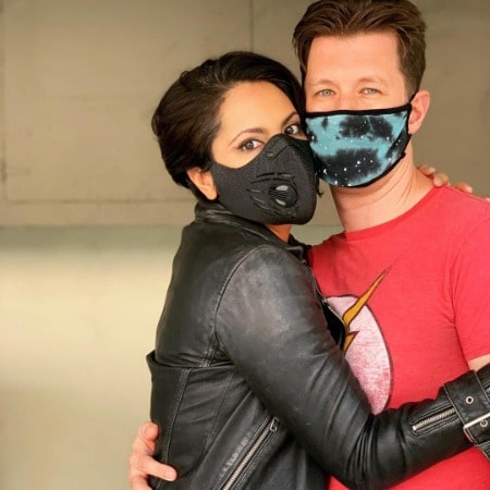 Zehra Fazel and Barry J Neely are hugging each other.